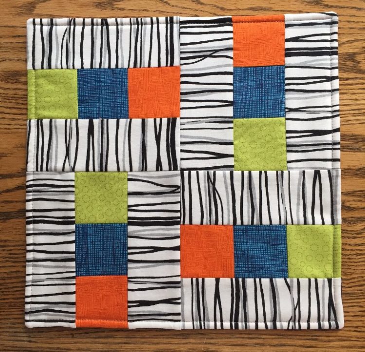 Tuesday, June 27, 1 – 4 pm
Rose Allen
Do you want to start quilting, but don’t know where to begin? Or maybe you are returning to the technique and need to refresh? This introductory-level class is designed for novice quilters who want to make their first quilt. Through the process of making simple blocks that will become a 12” by 12” tablemat, you will learn about fabric and pattern selection, preparing fabric, basic tools and how to use them, how to select the right thread, use a rotary cutter, and then learn to sew a scant seam (1/4