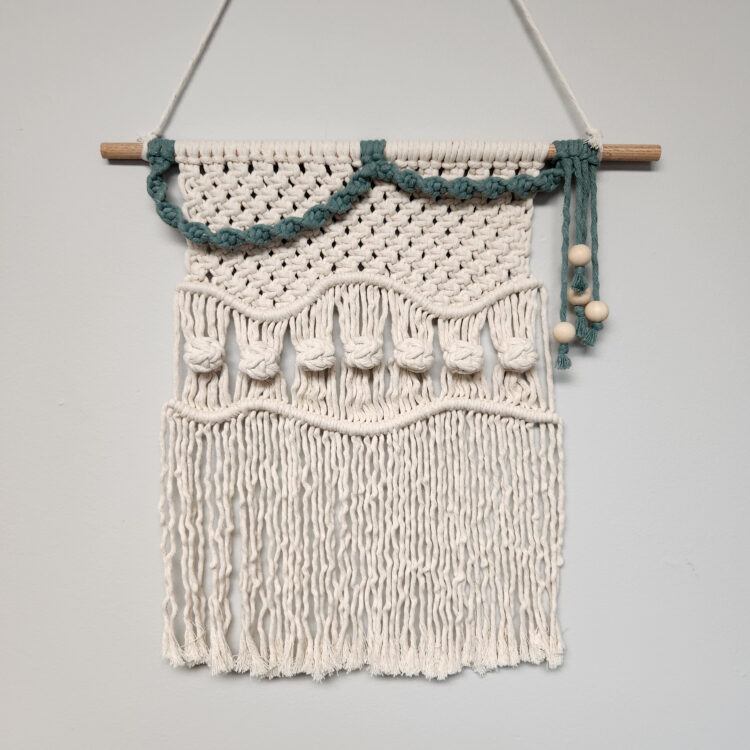 Saturday, April 27, 10 am – 2 pm
Haley Harnagel
Make a macramé wall hanging from start to finish! Learn 5 basic macramé knots — larks head, spiral knot, square knot, double half hitch, and berry knot — needed to create macramé works of art. Students will have options when it comes to customizing their wall hanging, like accent color choice and design variations, to make their piece one-of-a-kind. The goal is for students to leave with a completed macramé tapestry, along with the confidence and inspiration to continue making on their own!
Materials fee is $10, payable to instructor at the time of class, and covers all supplies needed for this class.




Instructor Bio:
Haley Harnagel (she/her) is a fiber artist located in the southern suburbs of the Twin Cities. She started her adventure into fiber arts in 2019 with macramé and branched into tapestry weaving in 2020. Haley started teaching macramé and tapestry weaving in 2021 and completed a large-scale community project called Intertwining Stories: A Macro Macramé Project that focused on bringing the community together after the pandemic. lifeafteraverage.com



Review our COVID-19 Safety Protocols at Textile Center here.
Want to become a member and receive the member price when you register? Click HERE to check out our membership levels, add a membership to the cart, and save 10% on all classes plus other benefits, including supporting a great organization!